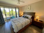 Guest room with queen size bed and private lanai